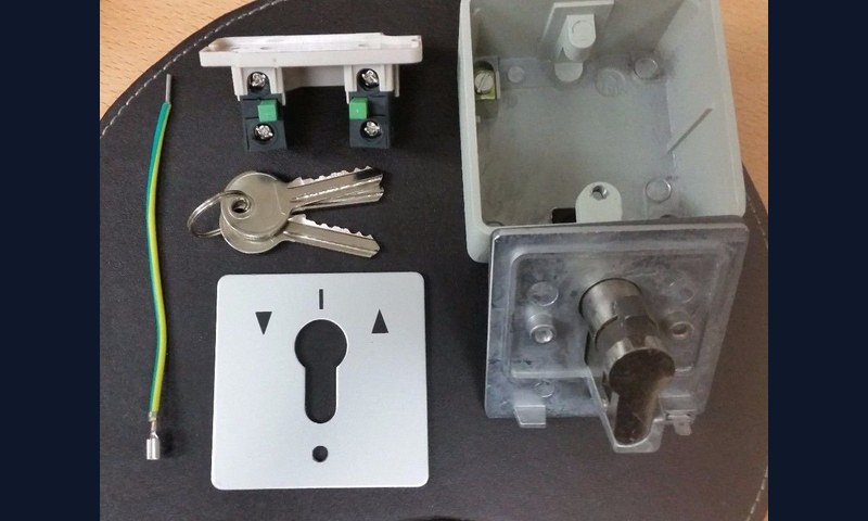 Remplacement interrupteur à clé volet roulant commerce Bruxelles - sécurisation vitrine